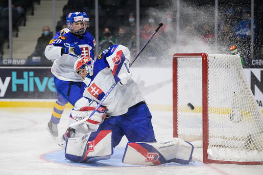 Goaltender Simon Latkoczy of Slovakia makes a save