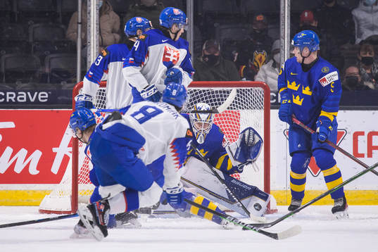 Goaltender Jesper Wallstedt of Sweden makes a save from