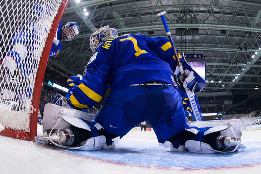 Juraj Slafkovsky of Slovakia challenges goaltender Jesper