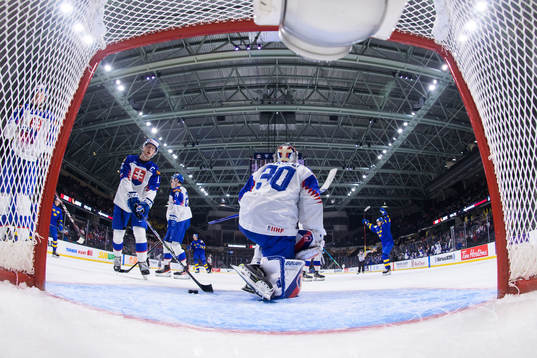 Samuel Knazko and goaltender Simon Latkoczy of Slovakia
