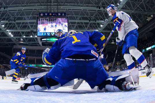 Goaltender Jesper Wallstedt of Sweden makes a save