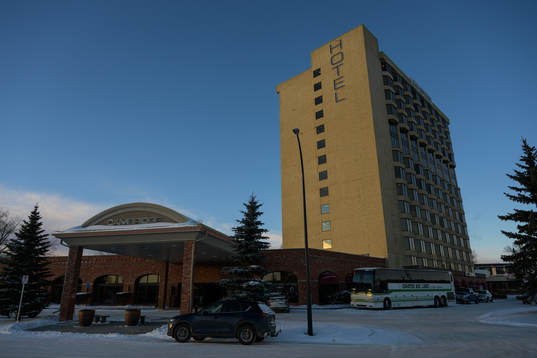 Exterior view of Cambridge Red Deer Hotel where teams have