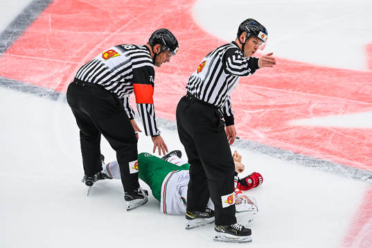 Referees attend to Anton Bengtsson of Rögle