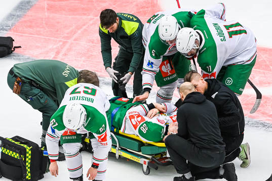 Anton Bengtsson of Rögle receives medical attention while
