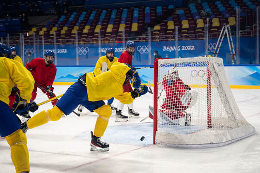 Linnea Johansson of Sweden scores a goal behind goaltender