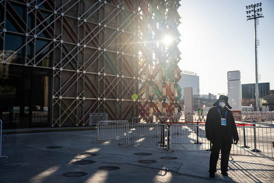 A man with a protective mask outside the practice venue of