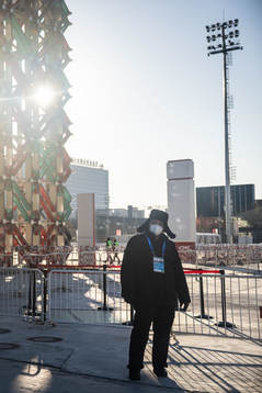 A man with a protective mask outside the practice venue of
