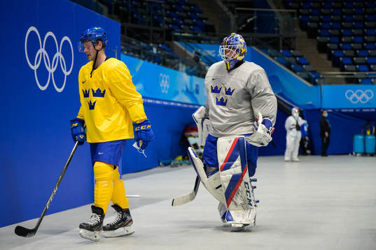 Lucas Wallmark and goaltender Lars Johansson of the Swedish