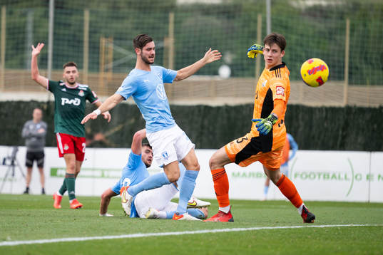 Adi Nalic of Malmö FF goalkeeper Daniil Khudyakov of