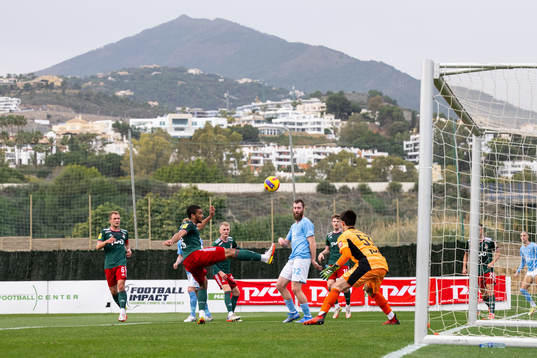 Jo Inge Berget of Malmö FF and goalkeeper Daniil Khudyakov