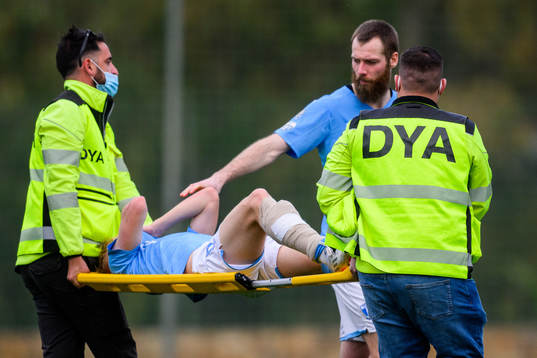 Jo Inge Berget of Malmö FF and injured Emil Lindman