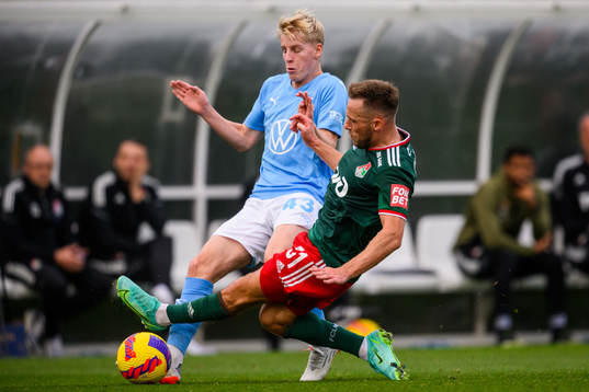 Emil Lindman of Malmö FF and Maciej Rybus of Lokomotiv