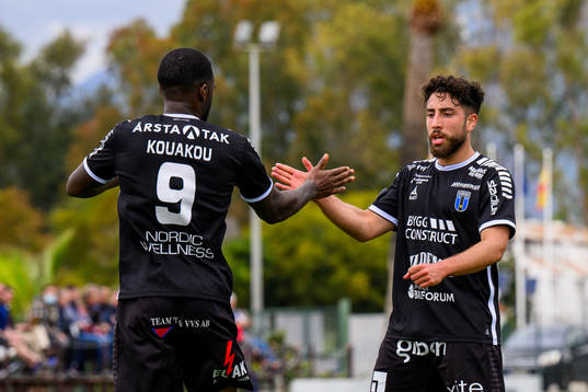 Christian Kouakou of Sirius celebrates with Moustafa Zeidan