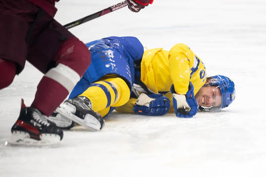 Mathias Bromé of Sweden in pain in an ice hockey