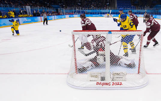 Lucas Wallmark of Sweden scores 3-0 behind goaltender Ivars