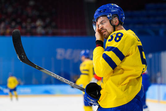 Anton Lander of Sweden looks dejected in an ice hockey