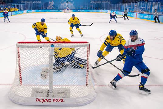 Goaltender Magnus Hellberg and Jacob de la Rose of Sweden