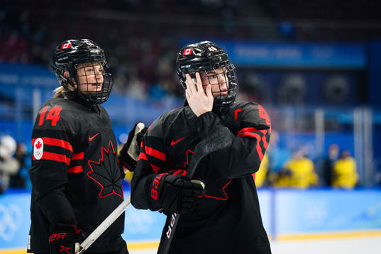 Renata Fast and Blayre Turnbull of Canada in an ice hockey
