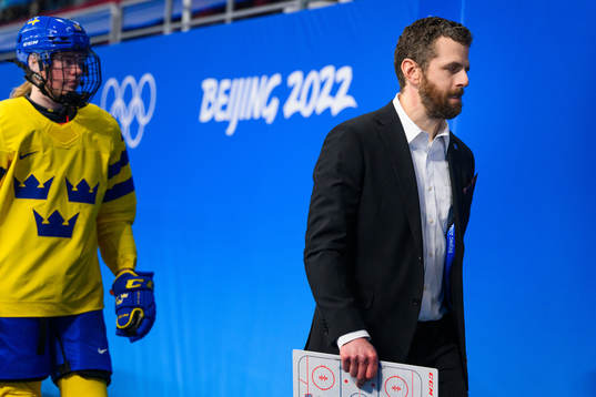 Head coach Ulf Lundberg of Sweden looks dejected in an ice
