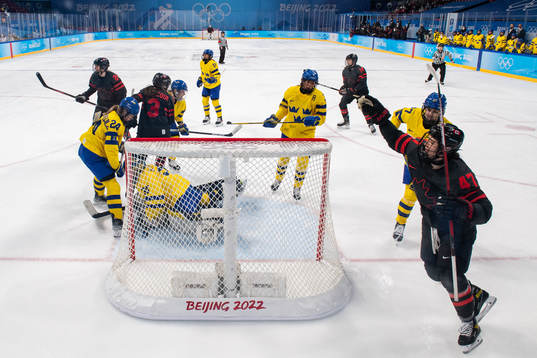 Jamie Lee Rattray of Canada celebrates a goal behind