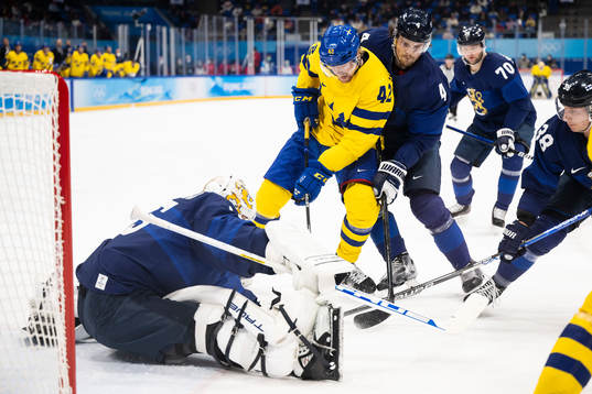 Joakim Nordström of Sweden against goaltender Jussi