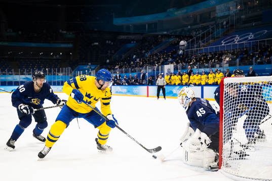 Anton Lander of Sweden and goaltender Jussi Olkinoura of