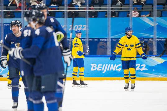 Fredrik Olofsson and Dennis Everberg of Sweden look dejected