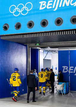 Max Friberg and head coach Johan Garpenlöv of Sweden walk