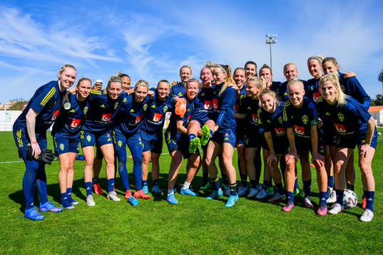 Players of Sweden pose for a group birthday photo