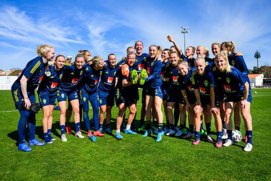 Players of Sweden pose for a group birthday photo