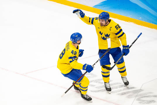 Carl Klingberg and Anton Lander of Sweden celebrate the 2-0