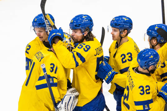 goaltender Lars Johansson and Anton Lander of Sweden