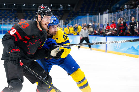 Tyler Wotherspoon of Canada and Anton Lander of Sweden in