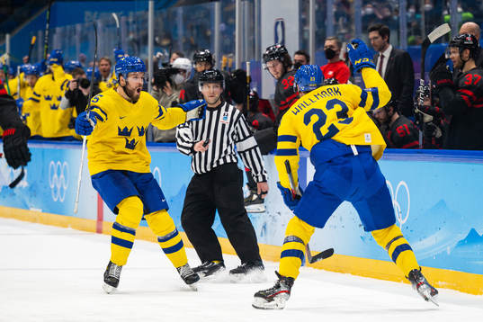 Oscar Fantenberg and Lucas Wallmark of Sweden celebrate the