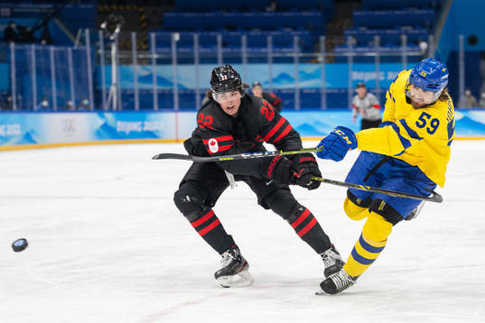 Owen Power of Canada and Linus Johansson of Sweden in the