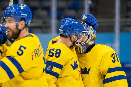 Anton Lander and goaltender Lars Johansson of Sweden