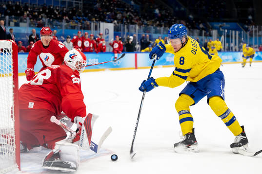Goaltender Ivan Fedotov of Russia and Fredrik Olofsson of