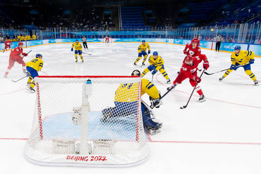 Goaltender Lars Johansson of Sweden and Anton Slepyshev of