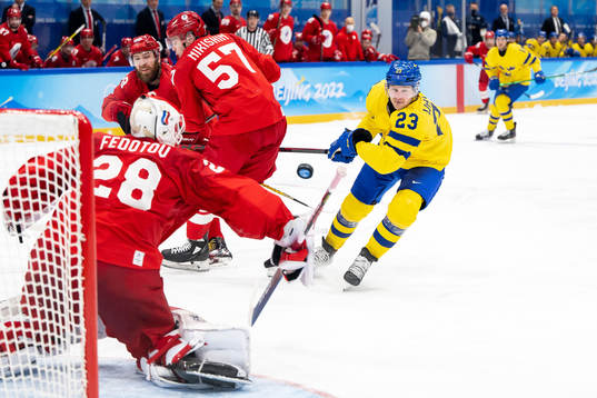 Goaltender Ivan Fedotov of Russia and Lucas Wallmark of