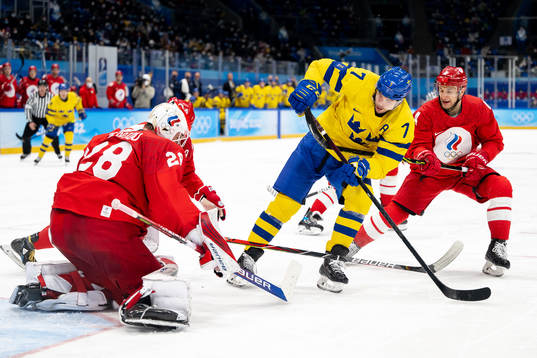 Goaltender Ivan Fedotov of Russia and Henrik Tömmernes of