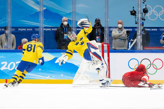 Goaltender Lars Johansson of Sweden and Pavel Karnaukhov of