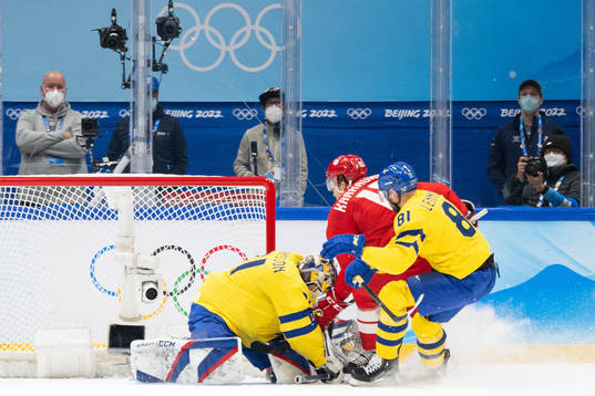 Goaltender Lars Johansson of Sweden and Pavel Karnaukhov of