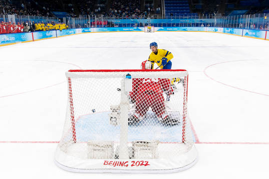 Max Friberg of Sweden against goaltender Ivan Fedotov of