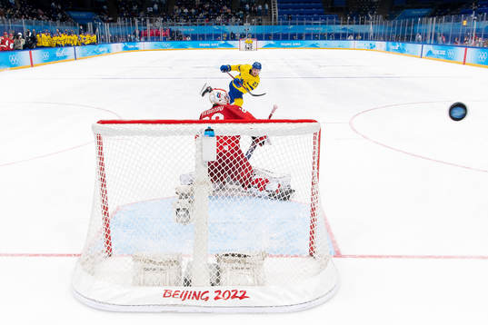 Lucas Wallmark of Sweden against goaltender Ivan Fedotov of