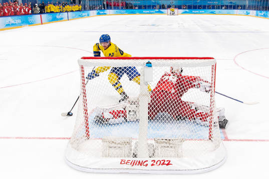Joakim Norström of Sweden against goaltender Ivan Fedotov