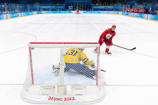 Arseni Gritsyuk of Russia against goaltender Lars Johansson