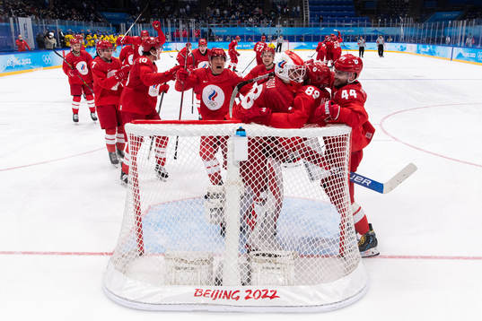 Goaltender Ivan Fedotov of Russia celebrate with teammates