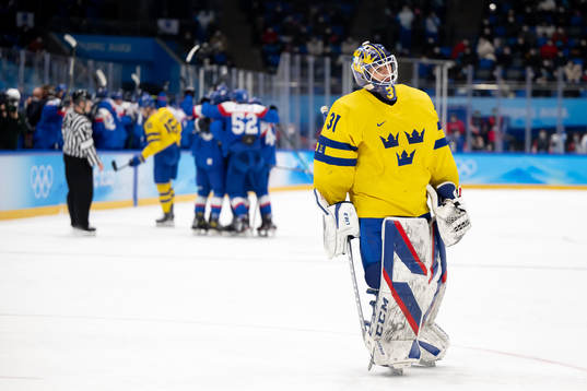 Goaltender Lars Johansson of Sweden looks dejected in the