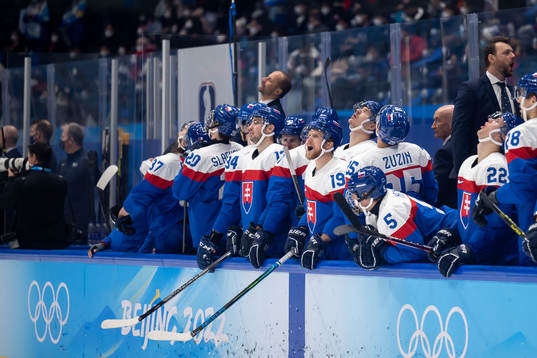 Players of Slovakia reacts in the men's ice hockey bronze