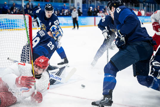 Vyacheslav Voynov of Russia against goaltender Harri